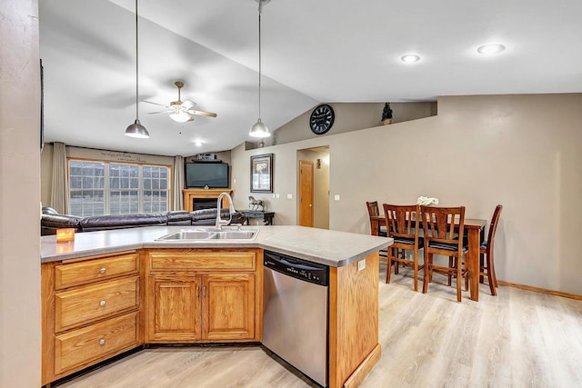 kitchen featuring dishwasher, lofted ceiling, sink, ceiling fan, and light hardwood / wood-style floors