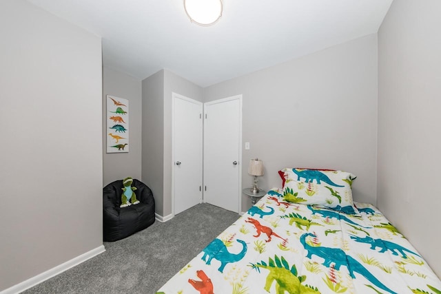 bedroom featuring dark colored carpet