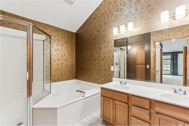 bathroom with shower with separate bathtub and vanity