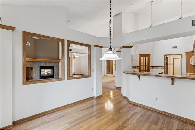 interior space featuring high vaulted ceiling and light wood-type flooring