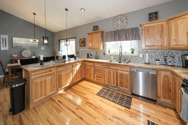 W3769 Alder Dr, Lake Geneva, WI 53147 - kitchen featuring dishwasher, a peninsula, plenty of natural light, light wood-style flooring, and vaulted ceiling