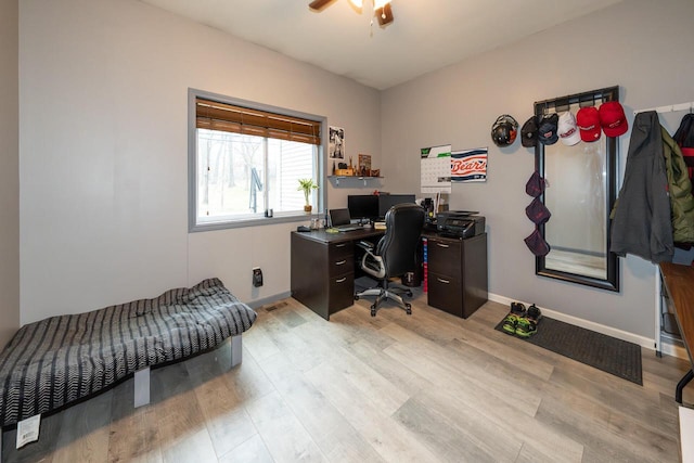 office featuring wood finished floors, baseboards, and ceiling fan