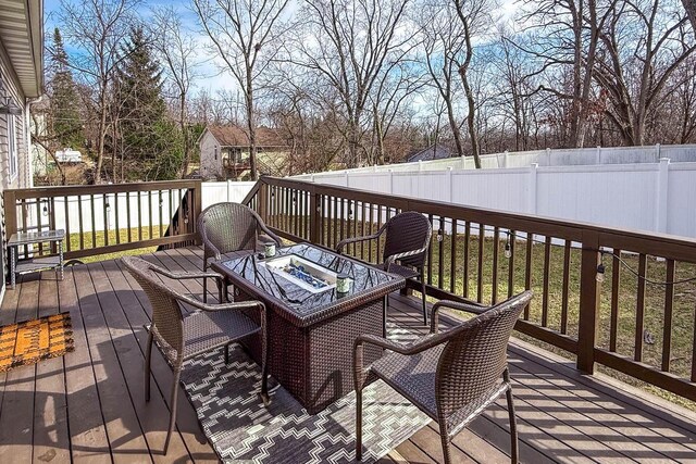W3769 Alder Dr, Lake Geneva, WI 53147 - wooden deck featuring a fenced backyard and a fire pit