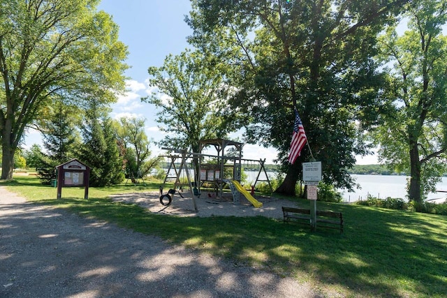 W3769 Alder Dr, Lake Geneva, WI 53147 - community playground featuring a yard, a water view, and a storage shed