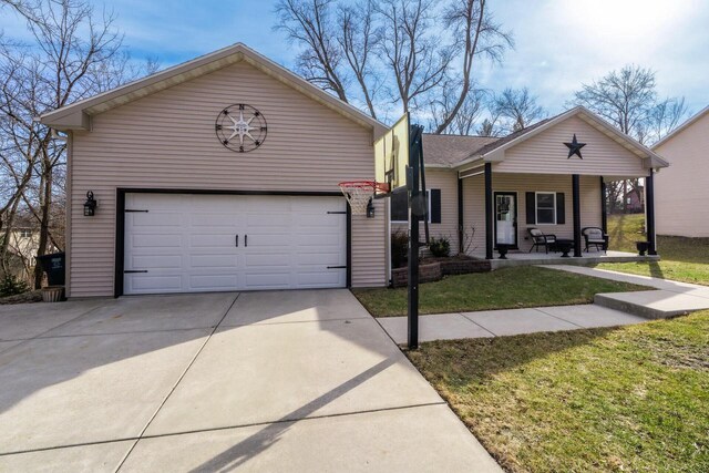 W3769 Alder Dr, Lake Geneva, WI 53147 - view of front of home featuring a porch, a front yard, and a detached garage
