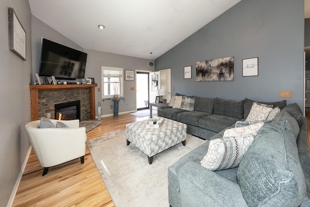 W3769 Alder Dr, Lake Geneva, WI 53147 - living area featuring lofted ceiling, light wood-type flooring, and a stone fireplace