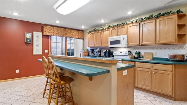 kitchen with tasteful backsplash, a breakfast bar, a kitchen island, and white appliances