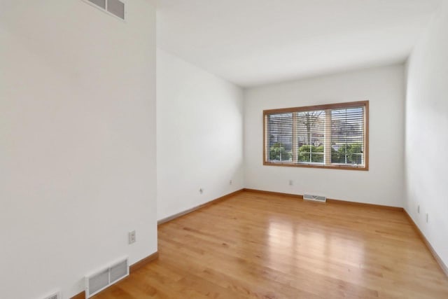 spare room featuring light wood-type flooring