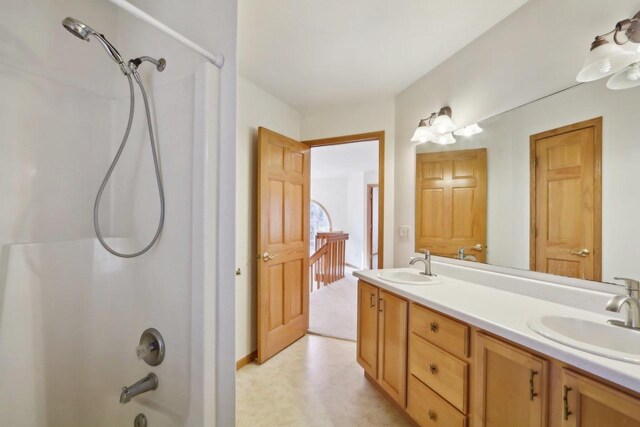 bathroom featuring vanity and tub / shower combination