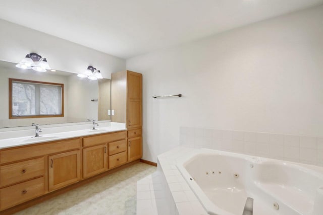 bathroom with tiled bath and vanity