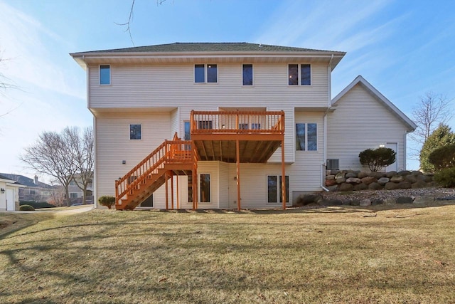 back of property featuring a deck, cooling unit, and a lawn