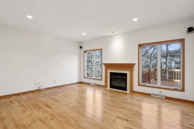 unfurnished living room featuring light hardwood / wood-style floors