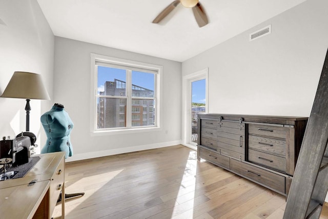 bedroom featuring light hardwood / wood-style floors and ceiling fan