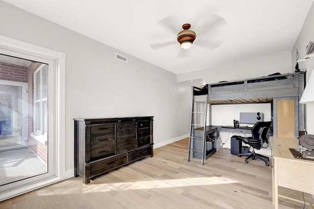 bedroom with ceiling fan and light hardwood / wood-style floors