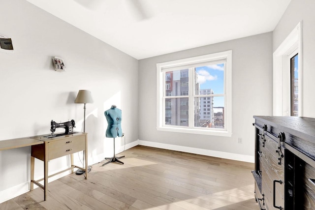 office area with light hardwood / wood-style floors