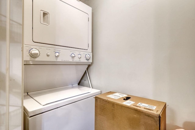 laundry area featuring stacked washing maching and dryer