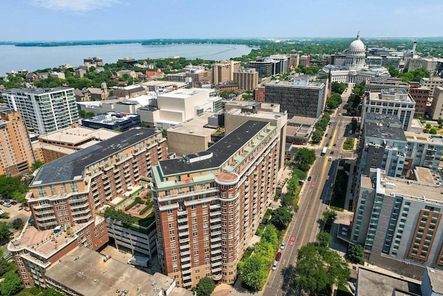 birds eye view of property with a water view