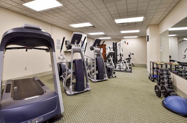 workout area featuring a drop ceiling