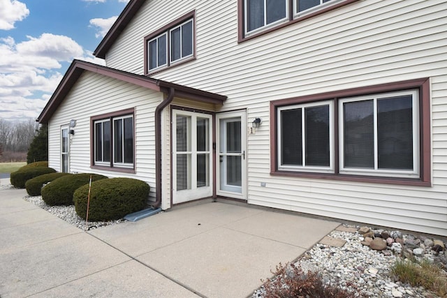 view of side of home featuring a patio area