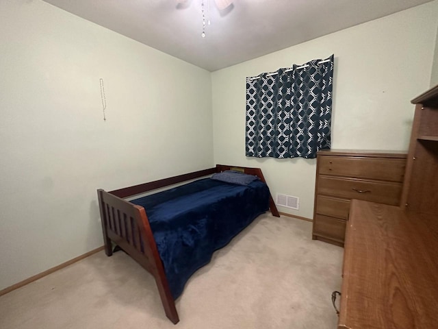 bedroom with light carpet and ceiling fan