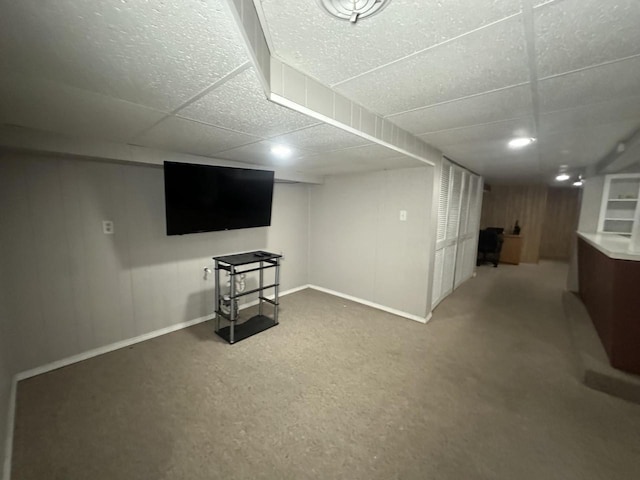 basement featuring a drop ceiling