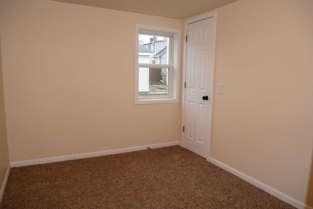 spare room featuring carpet flooring