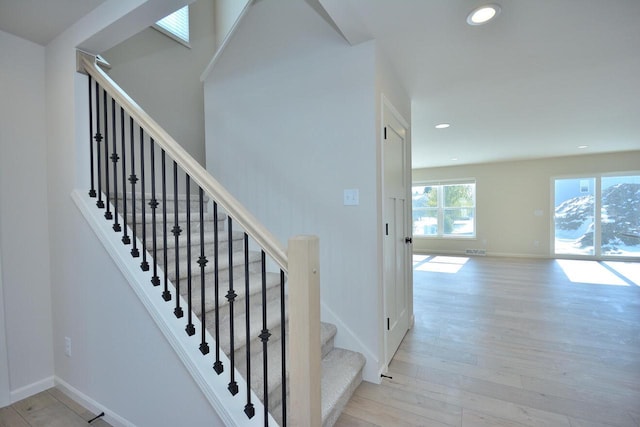 staircase featuring hardwood / wood-style flooring