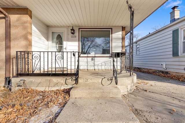 entrance to property featuring a porch