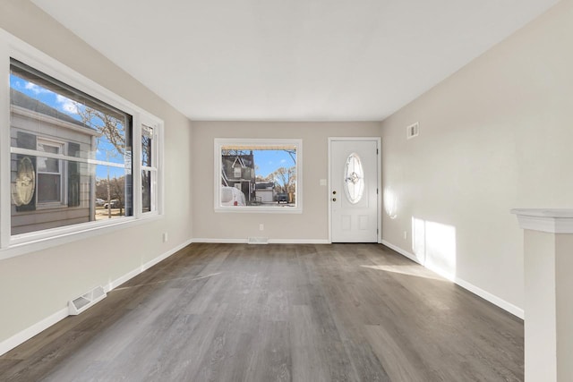 entrance foyer featuring dark hardwood / wood-style floors