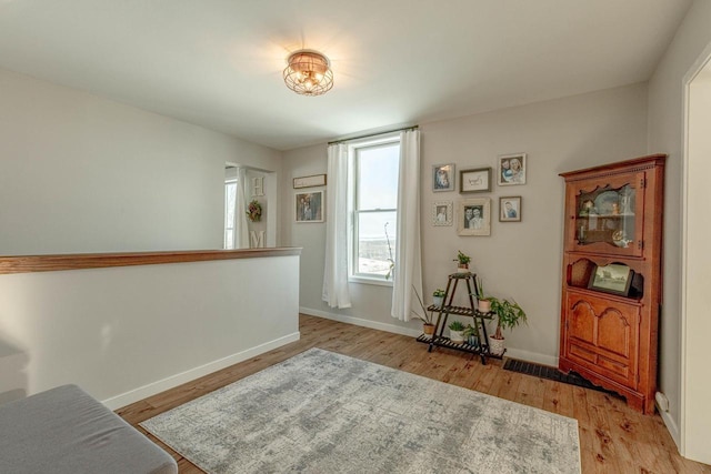 sitting room with light hardwood / wood-style floors