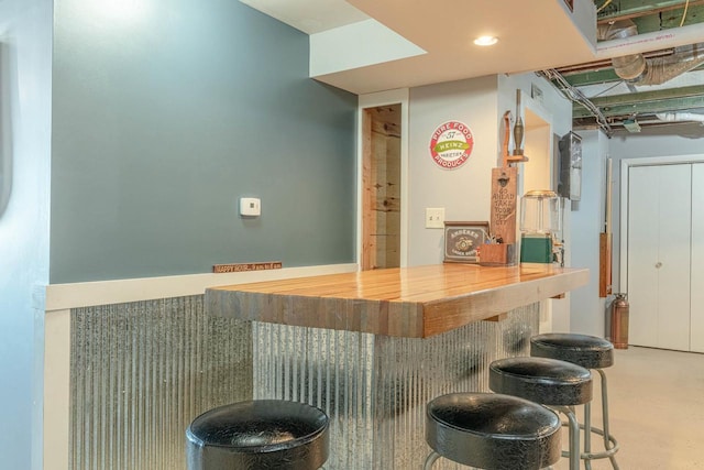 bar featuring butcher block counters