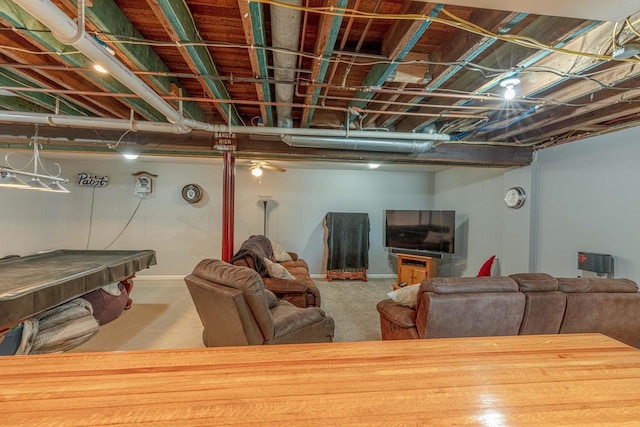 basement with carpet, ceiling fan, and pool table