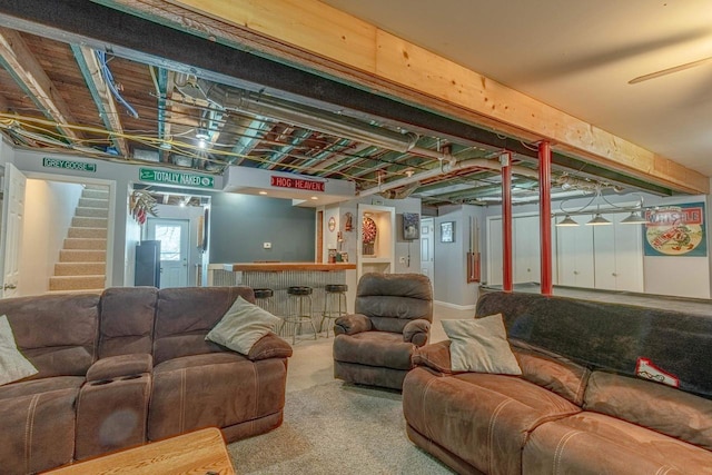 basement featuring carpet and indoor bar