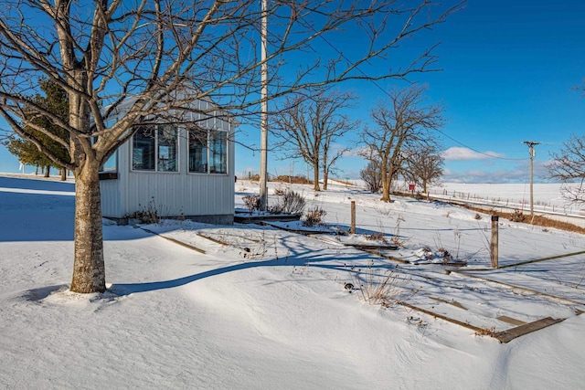 view of yard covered in snow