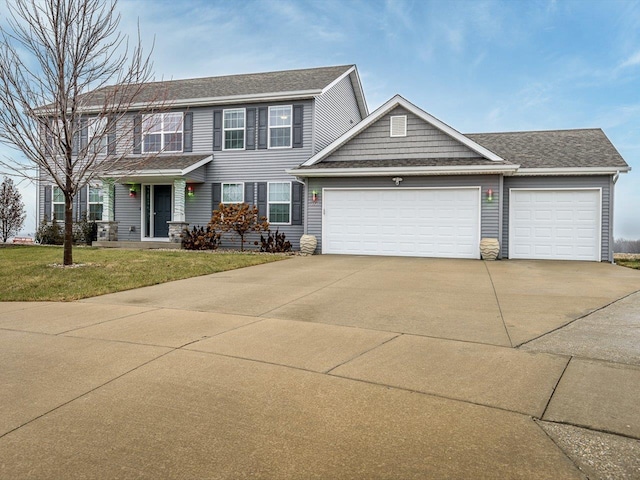 view of front facade featuring a garage and a front yard