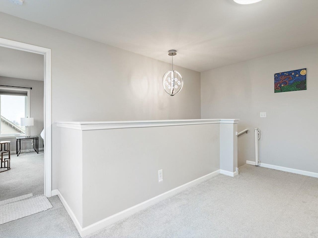 interior space featuring light carpet and an inviting chandelier