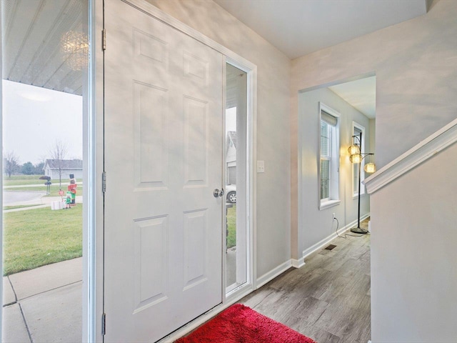 foyer entrance with light wood-type flooring