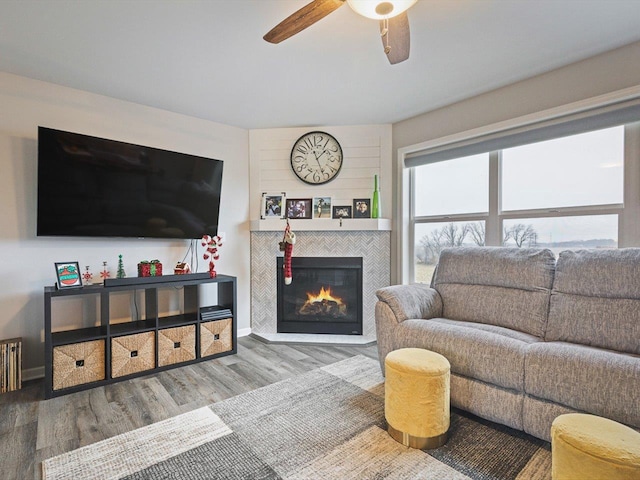 living room with hardwood / wood-style floors and ceiling fan