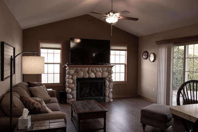 living room with hardwood / wood-style flooring, vaulted ceiling, and a wealth of natural light