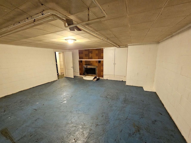 basement featuring a tile fireplace