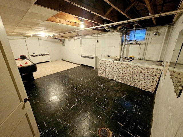 basement featuring radiator heating unit