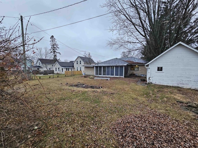 view of yard with a sunroom