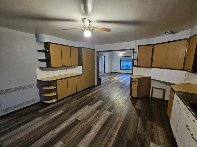 kitchen featuring backsplash, dark hardwood / wood-style floors, ceiling fan, baseboard heating, and radiator heating unit