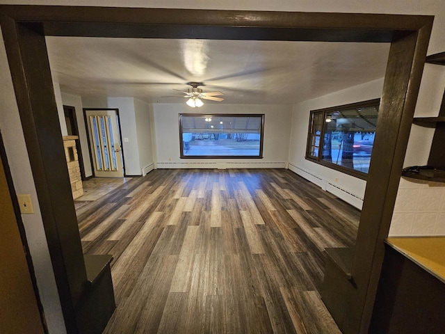 interior space featuring ceiling fan and dark wood-type flooring