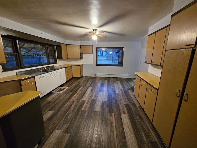 kitchen with ceiling fan, dark wood-type flooring, and a baseboard heating unit