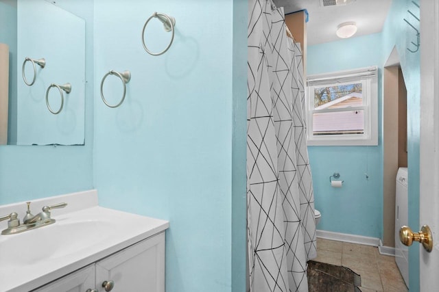 bathroom featuring tile patterned floors, vanity, and walk in shower