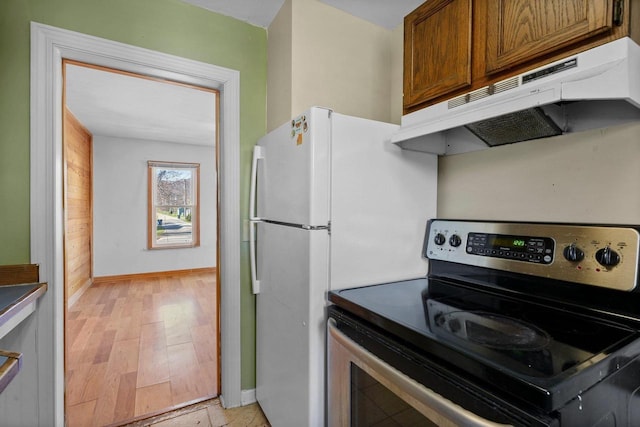 kitchen with light hardwood / wood-style floors and electric stove