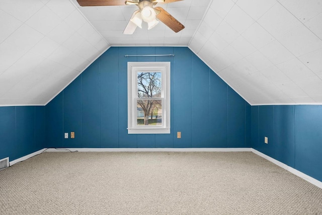 bonus room with ceiling fan, carpet, and vaulted ceiling