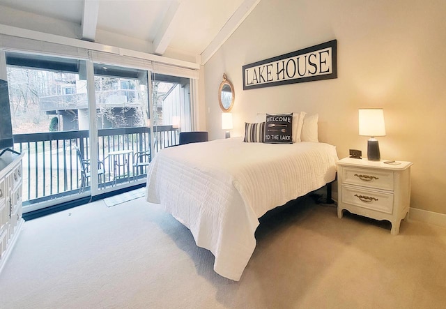 carpeted bedroom with vaulted ceiling with beams and access to exterior