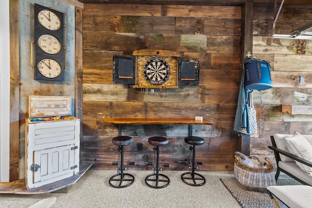 bar featuring wood walls